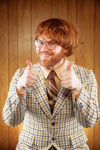 Happy Nerdy 60s Game Show Host Giving 2 Thumbs Up
